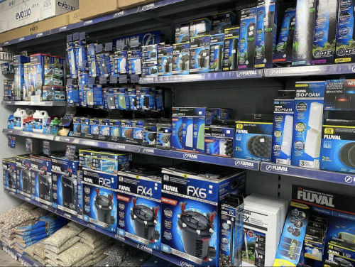 Shelves of Fluval filters, aquarium treatments and aquatic supplies
